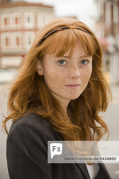 Portrait Of Redhaired PreTeen Girl With Freckles Rig