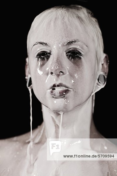 Young Woman With Milk Pourin