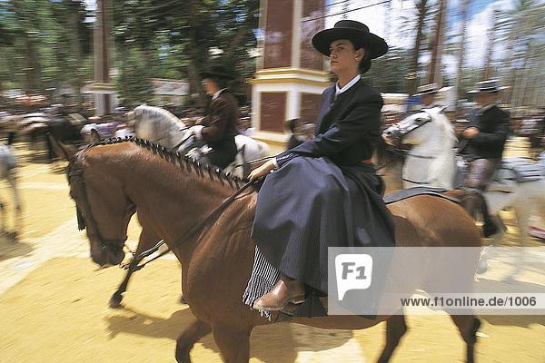 Young woman riding horse in festival  Jerez De La Frontera  Andalusia  Spain