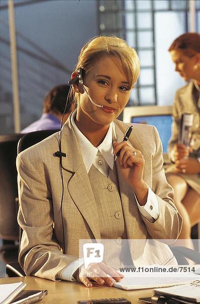 Portrait of a businesswoman wearing a headset in an office