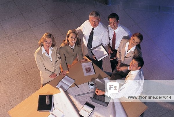 High angle view of group of business people smiling in an office