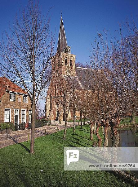 Bare trees in front of church  Netherlands