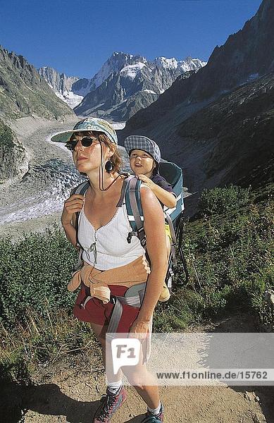 Female hiker with baby on mountain peak  Grand Jorasses  Mont Blanc Massif  France