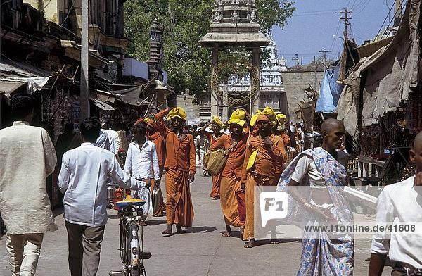 Buddhist monks walking on road  Tirumala  Andhra Pradesh  India