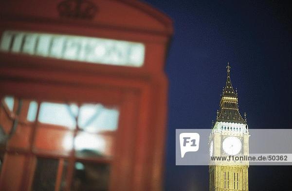 Close-up of public telephone booth with clock tower in background  Big Ben  London  England