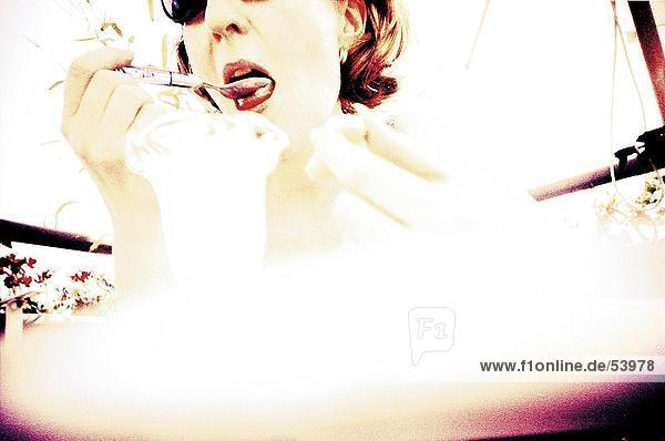 Woman eating ice cream  blurred