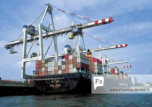 Low angle view of cargo containers on ship at harbor  Hamburg  Germany