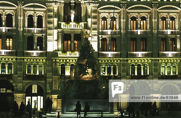 Facade of city hall illuminated at night  Italy  Europe