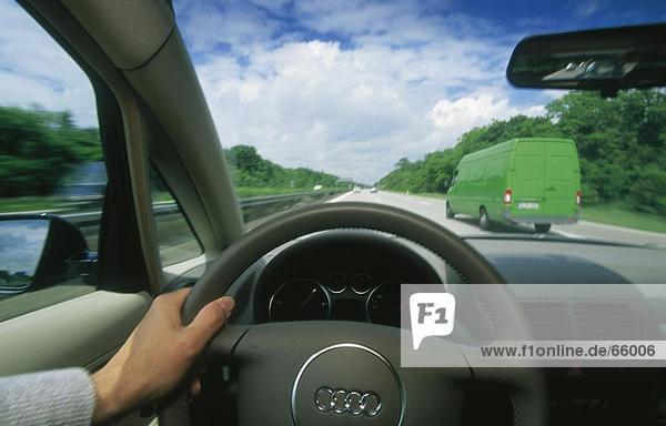 Driver driving car on highway