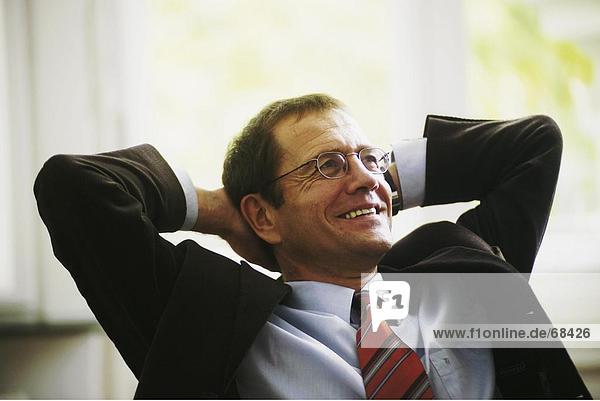 Close-up of businessman smiling in office
