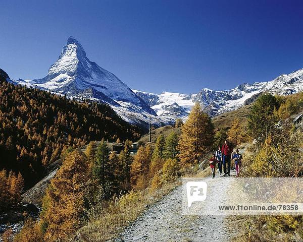 10651532  alpine  Alps  mountains  family  autumn  scenery  Matterhorn  landmark  mountain  Switzerland  Europe  model release