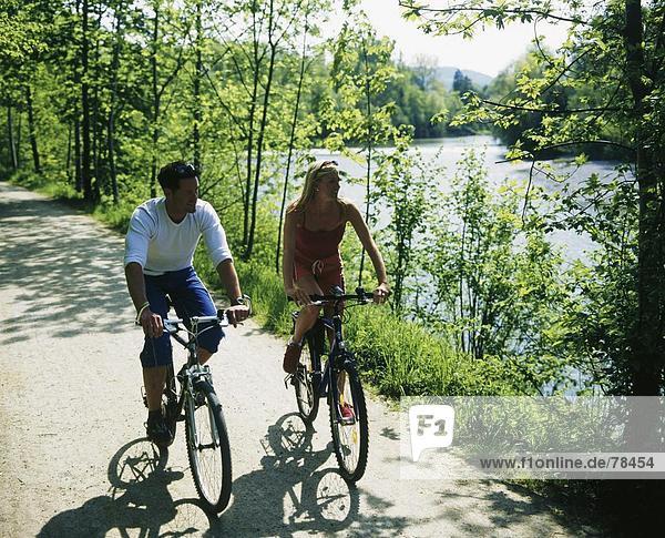 10652078  go  bicycle  bike  river  flow  spare time  model released  mountain bikes  nature  pair  couple  Switzerland  Europ
