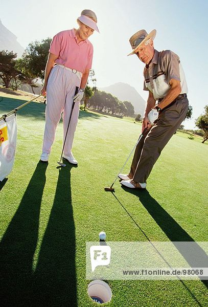 Sport & Recreation. Golf. Seniors. Couple