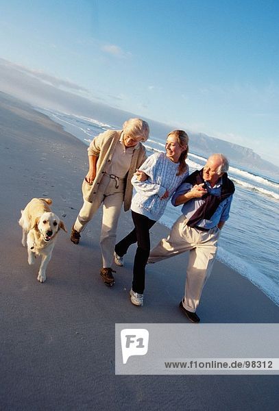 Family. Adult family. Beach. Pet. Dog
