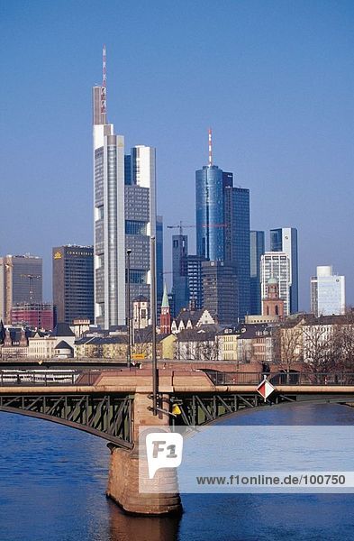 Bridge across river with skyscrapers in background  Ignatz Bubis Bridge  River Main  Frankfurt  Hesse  Germany