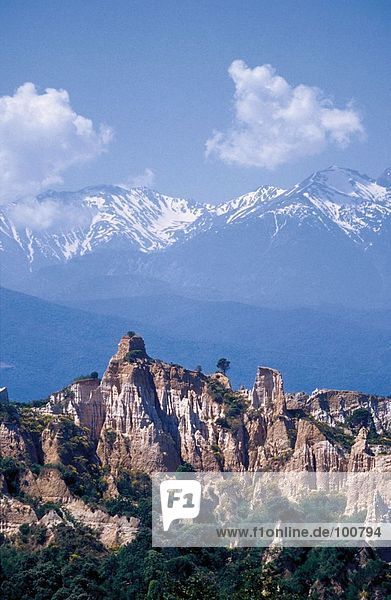 Rock formations on landscape with mountains in background  Pyrenees  Ille Sur Tet  France