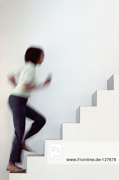Woman running upstairs