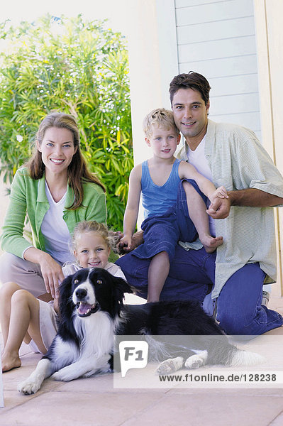 Familie mit einem Collie-Hund