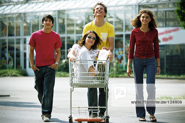 Teenagers with shopping trolley