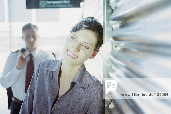 Businessman and businesswoman in airport terminal