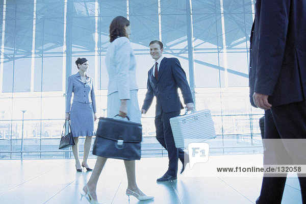 Businesspeople in airport terminal