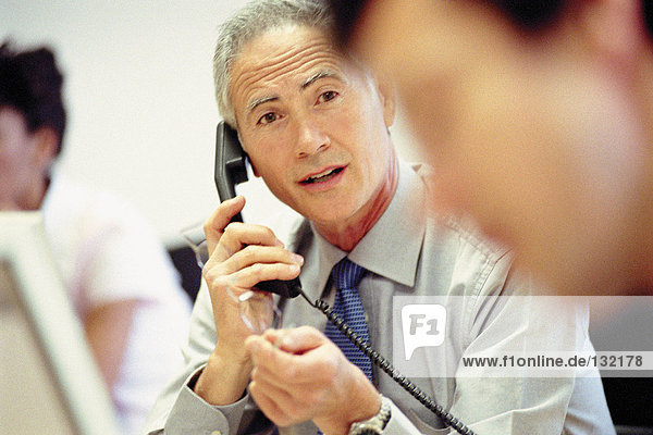 Businessman on telephone in office