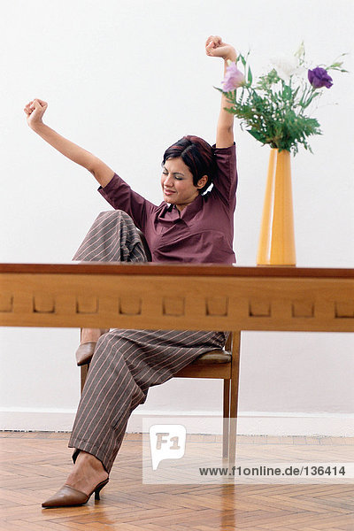 Businesswoman stretching