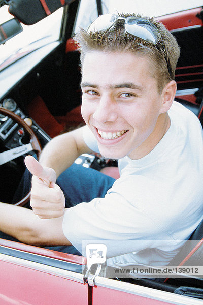 Young man in sports car