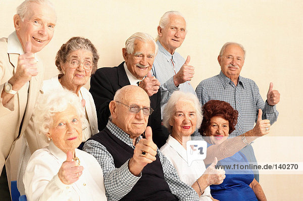 Elderly giving thumbs up sign