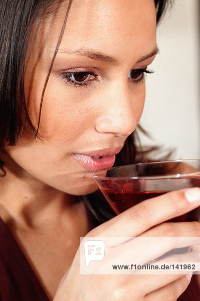 Woman drinking a cocktail
