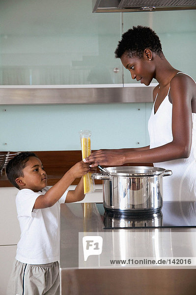 Mother and son in kitchen