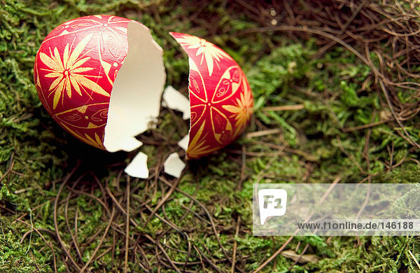 Broken easter egg on grass