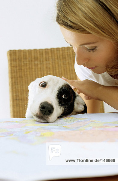 Dog and lady owner with map