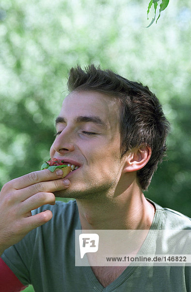 Young man eating food
