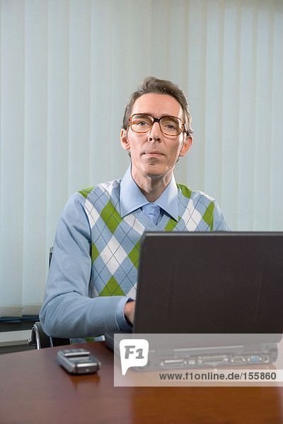 Office worker using laptop computer