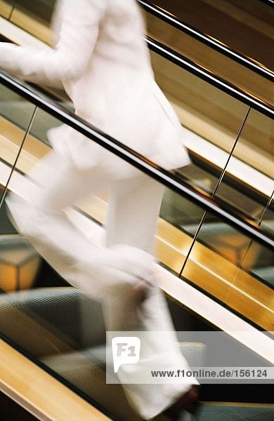 Woman running up stairway