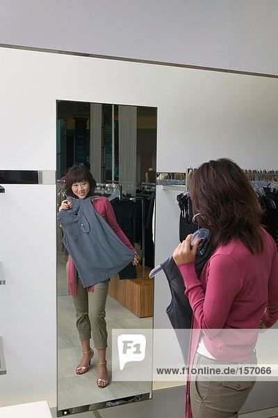 Young woman in clothes store