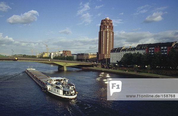 Container ship in river  Main River  Floesserbruecke Bridge  Frankfurt  Germany