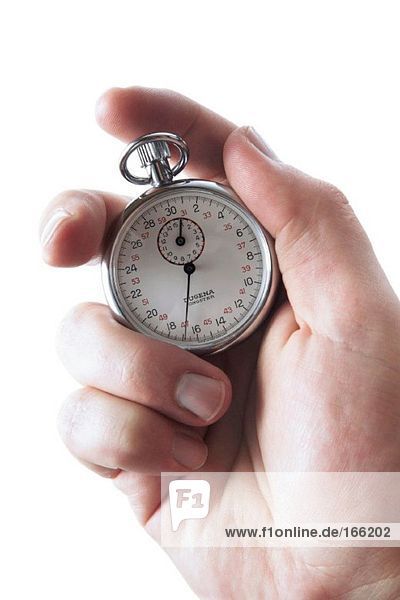 Man's hand holding Stop watch