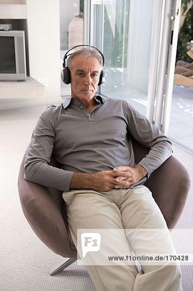 Mature man wearing headphones