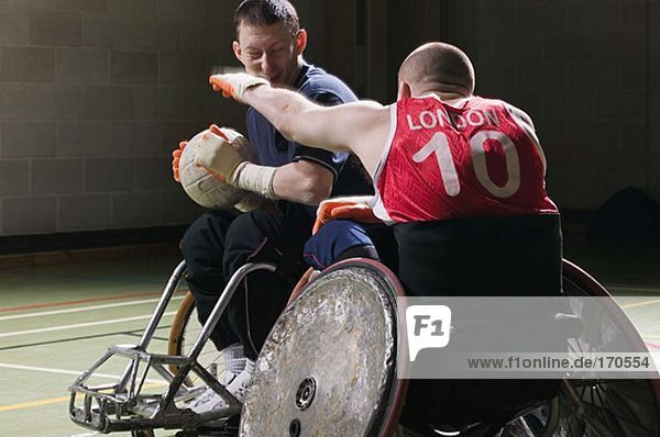 Men playing quad rugby