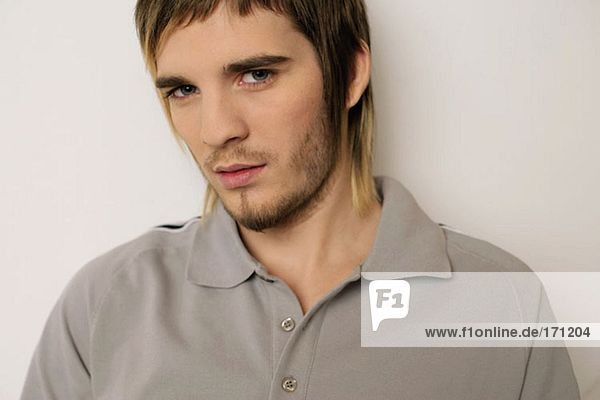Young man in a grey polo shirt
