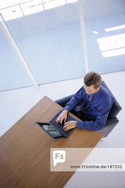 Office worker using laptop computer