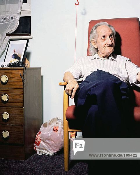 Elderly man in an armchair