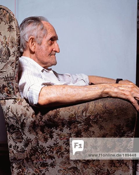 Elderly man in armchair