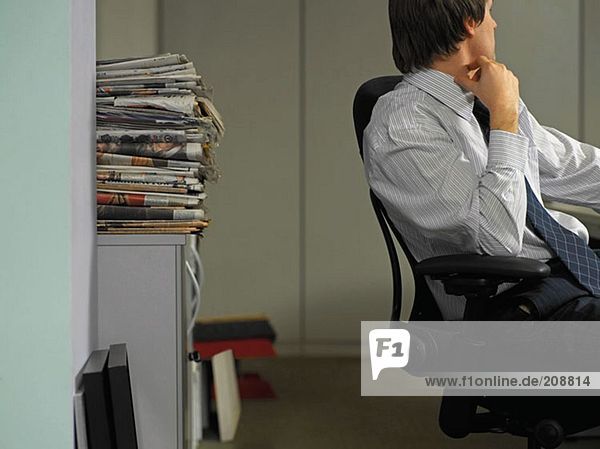 Office worker scratching his neck