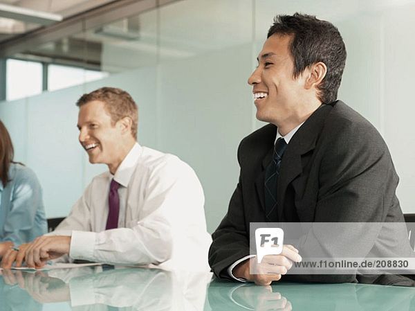 Office workers laughing
