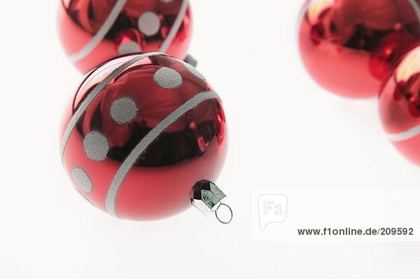 Four red baubles