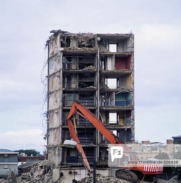 Crane demolishing a building