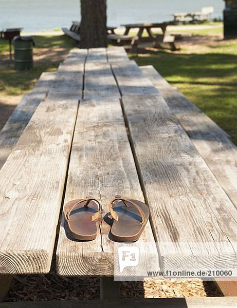 Sandals on a picnic bench